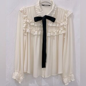 Cream blouse, ruffled with ribbon bow